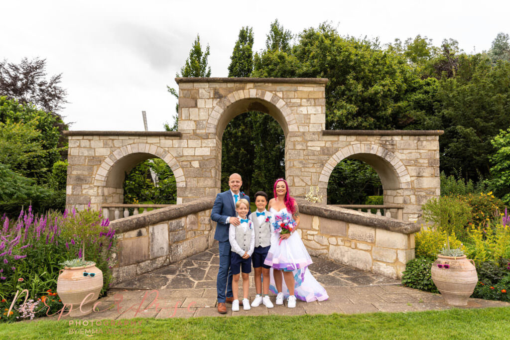 Bride and groom with their children