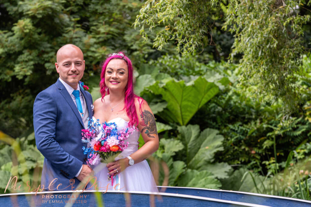 Bride and groom on a blue bridge