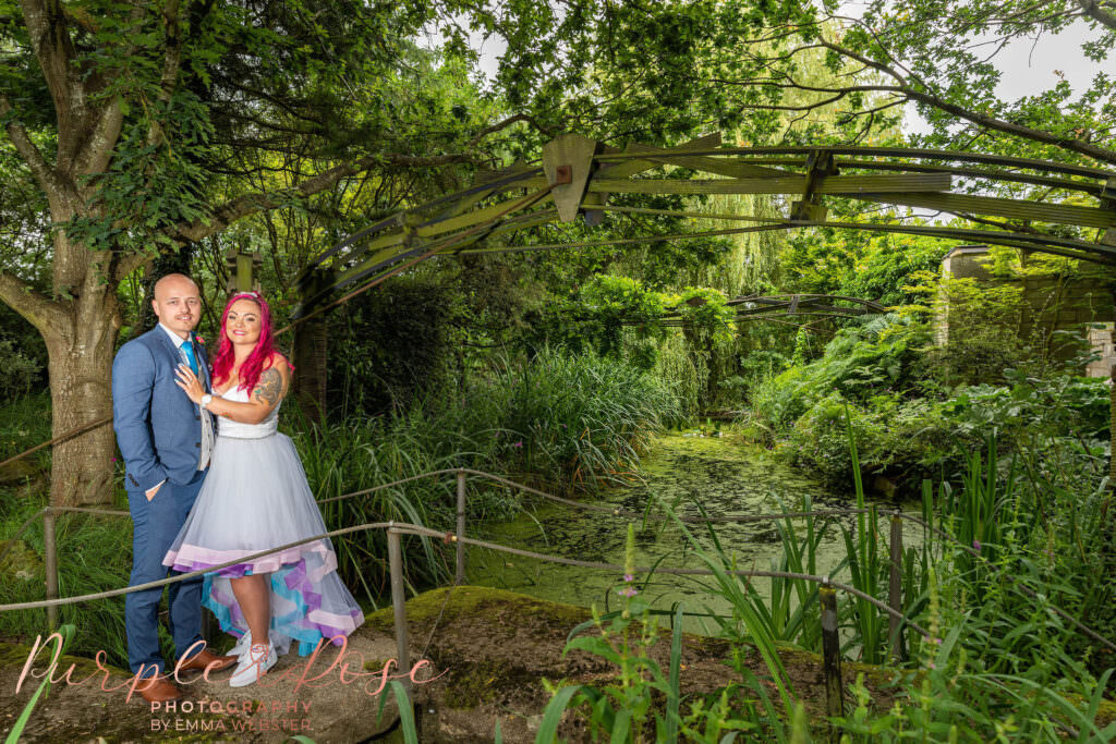 Bride and groom stood in Flaxbourne gardens