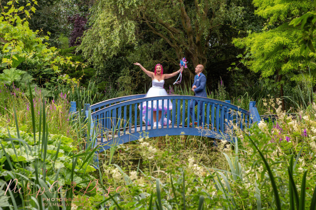 Bride and groom on a blue bridge