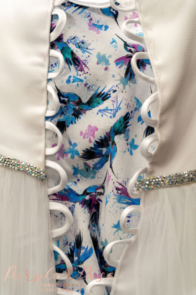 Hummingbird detail on brides wedding dress