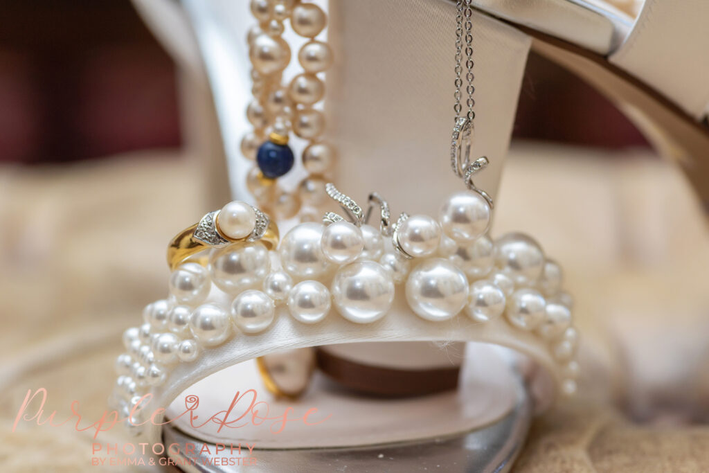 Close up photo of abrides shoe and wedding ring on her wedding day in Milton Keynes