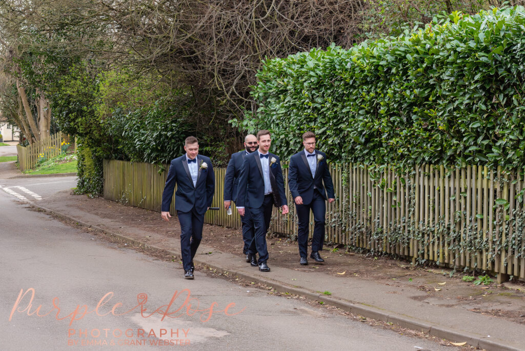 Photo of a groom walking to his wedding ceremony in Milton Keynes