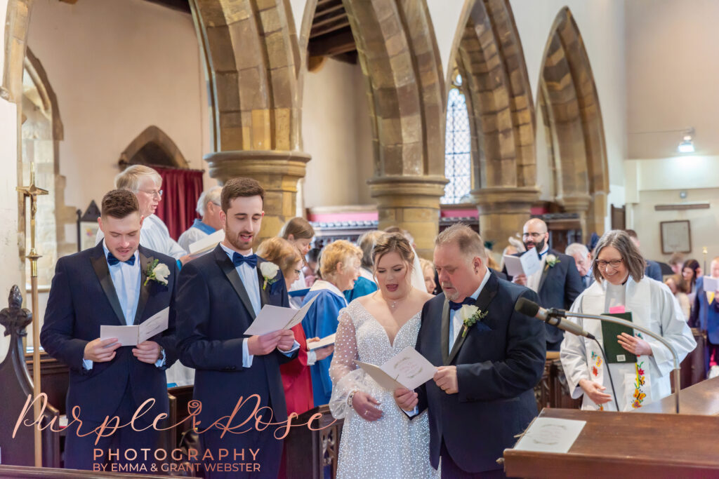 Photo of bride and groom during their wedding ceremony in Milton Keynes