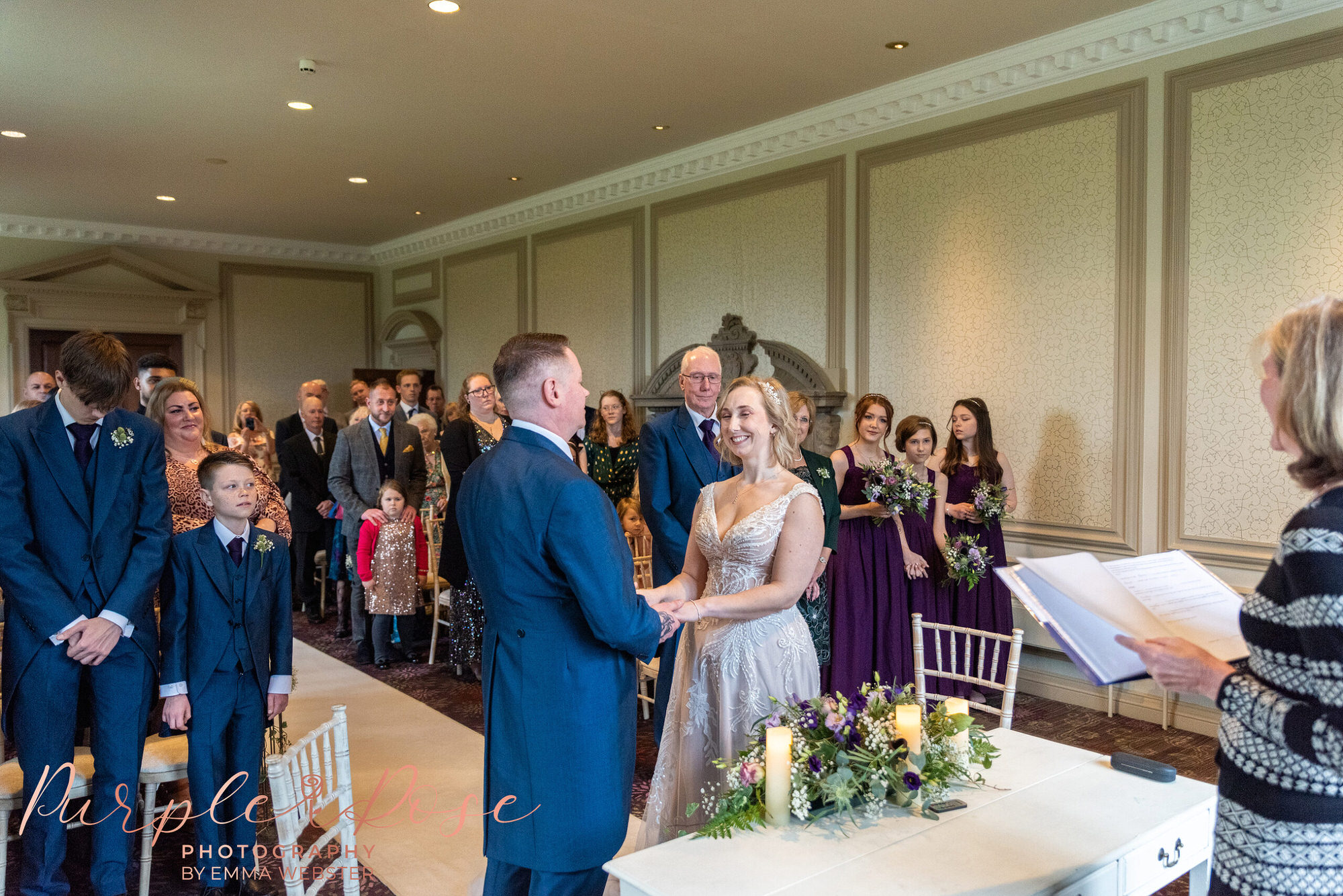Bride and groom surrounded by guests during wedding ceremony