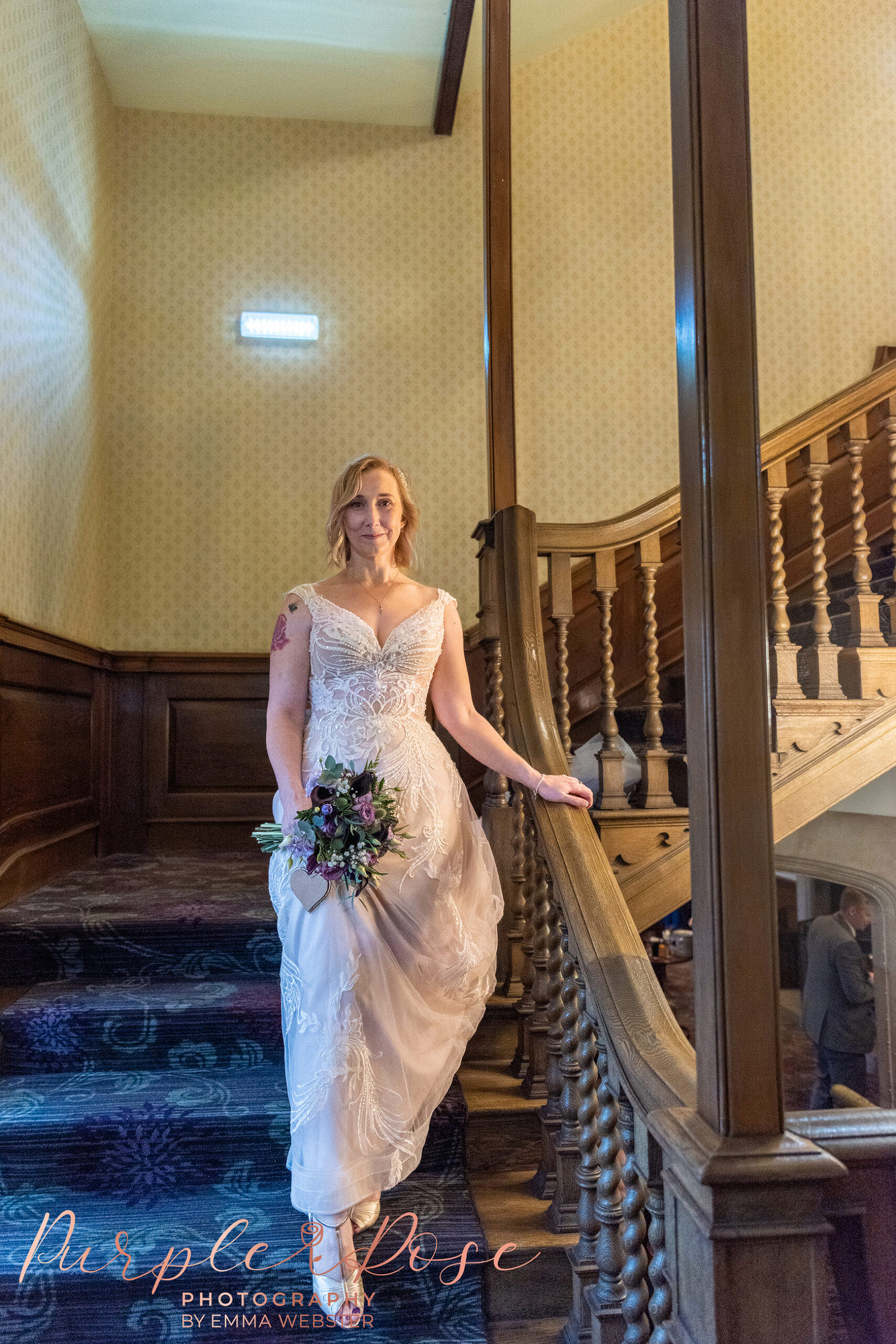 Bride walking down staircase
