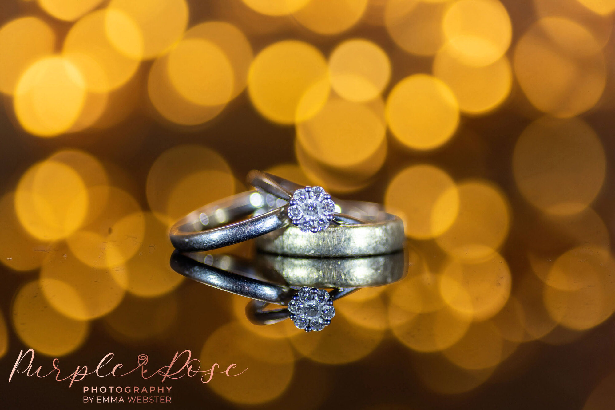 Wedding rings stacked together with engagement ring
