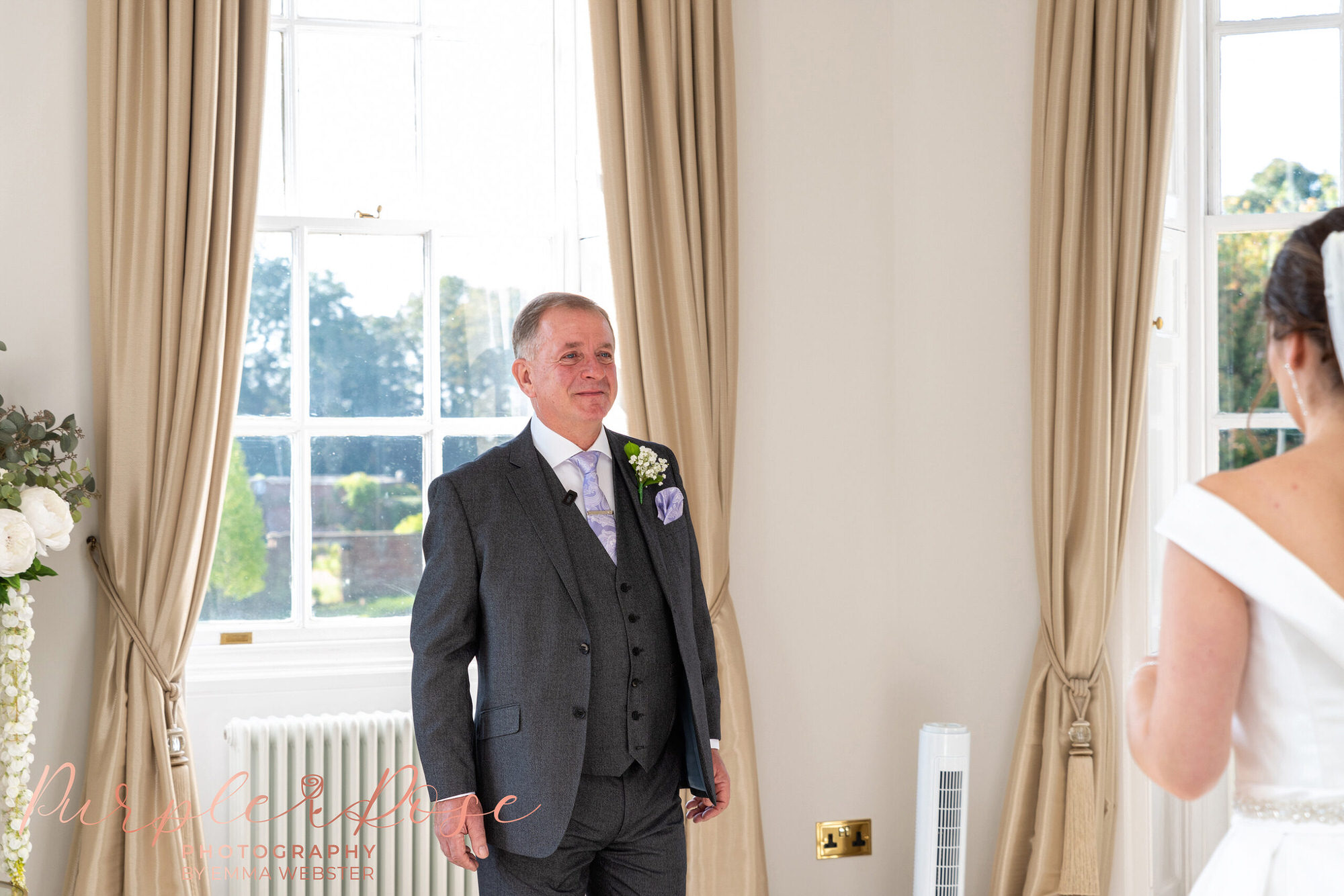 Father seeing his daughter in her wedding dress for the first time