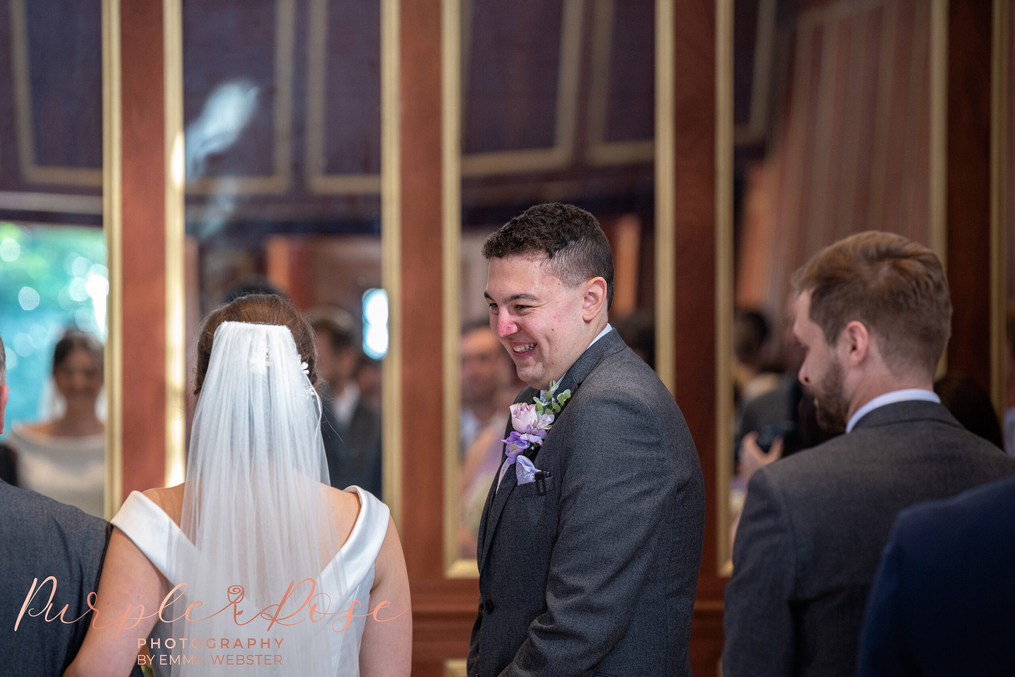Groom laughing during wedding ceremony