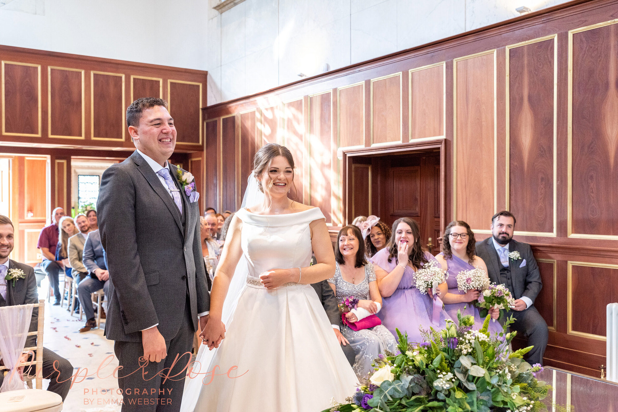 Bride and groom laughing during their wedding ceremony