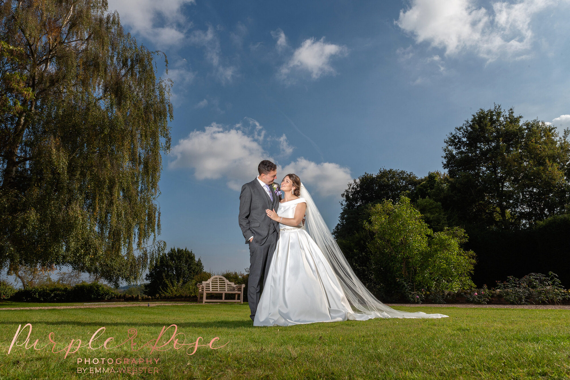 bride and groom in their wedding venues garden