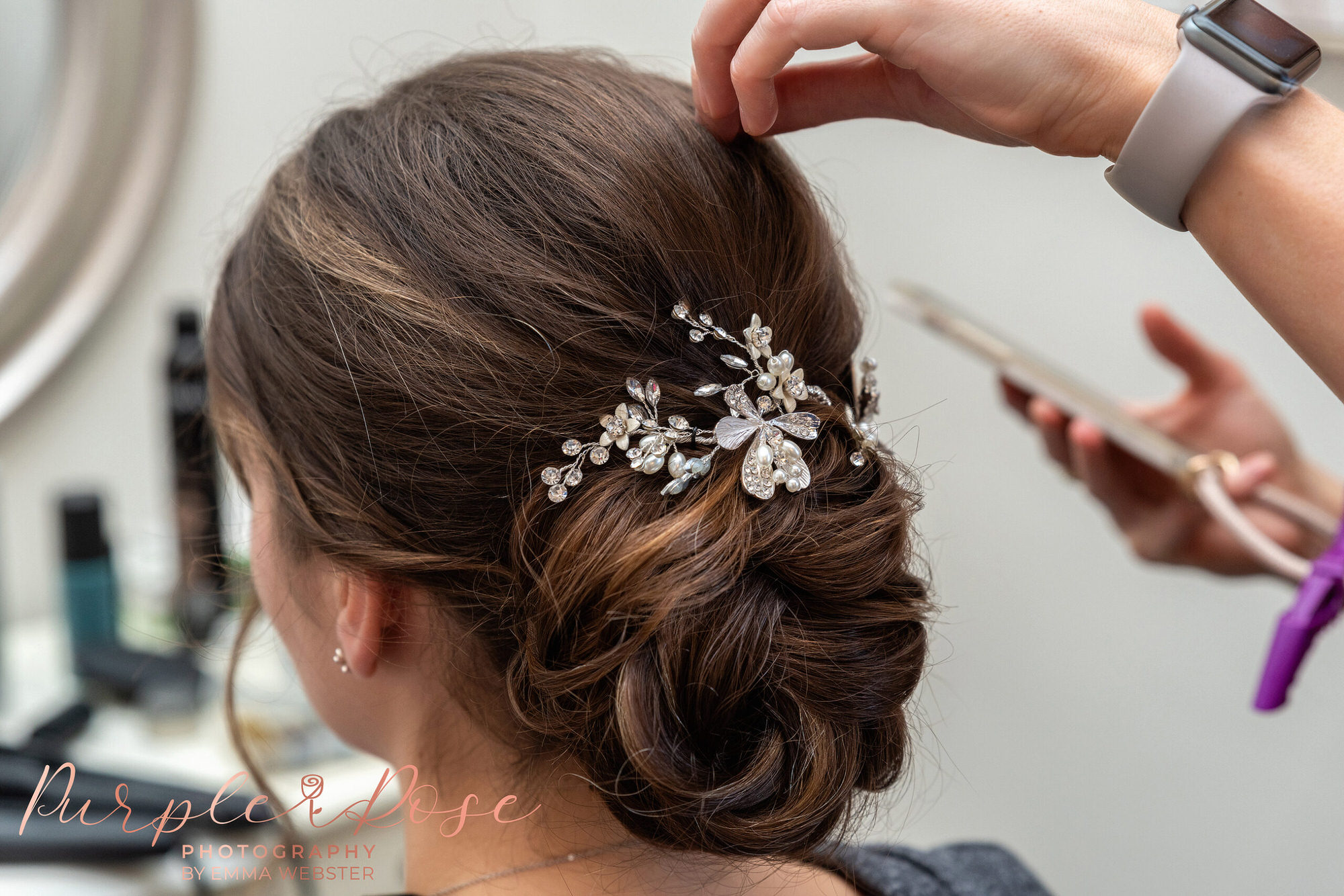 Brides hair being adjusted