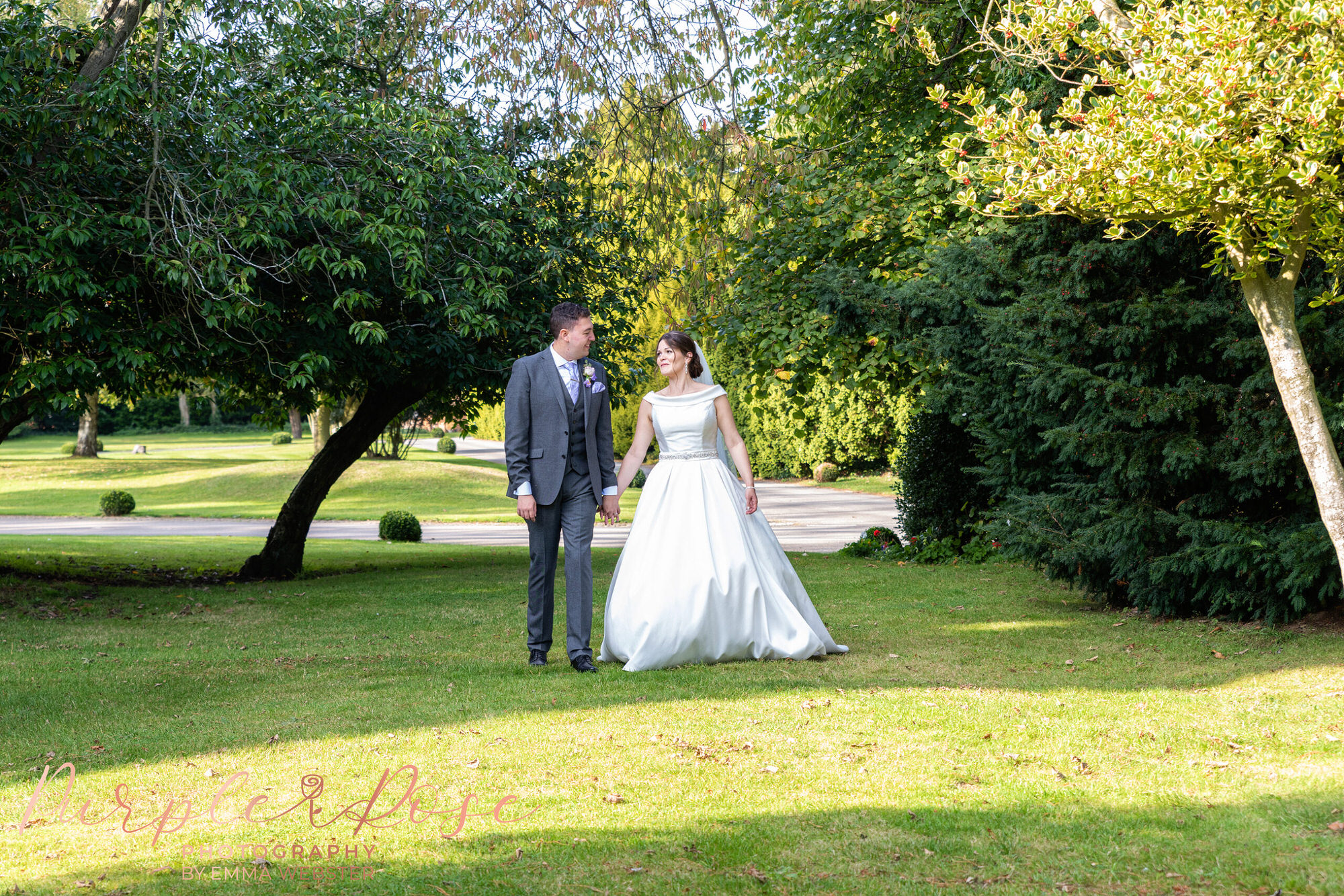 Bride and groom walking hand in hand