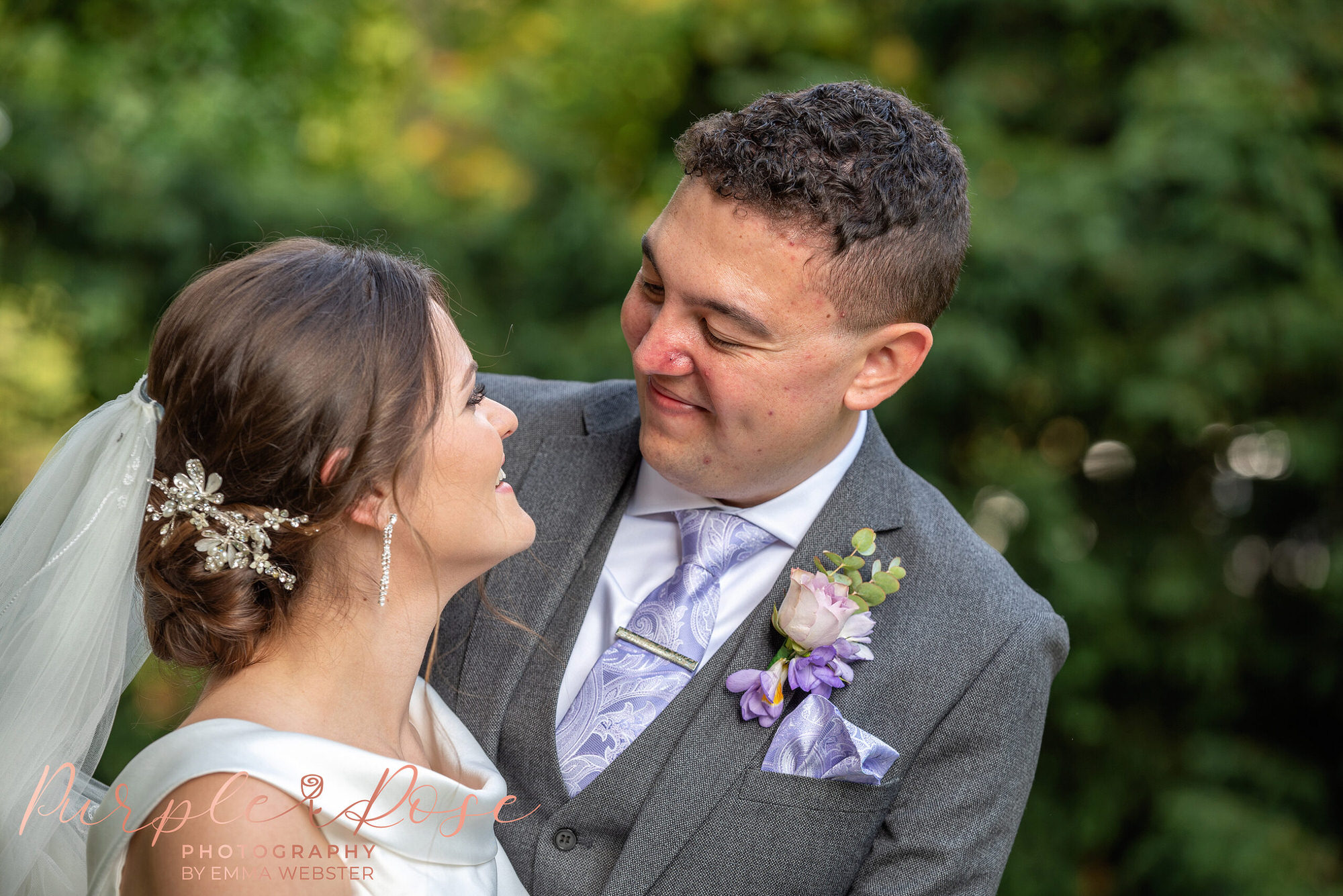 Groom smiling at his bride