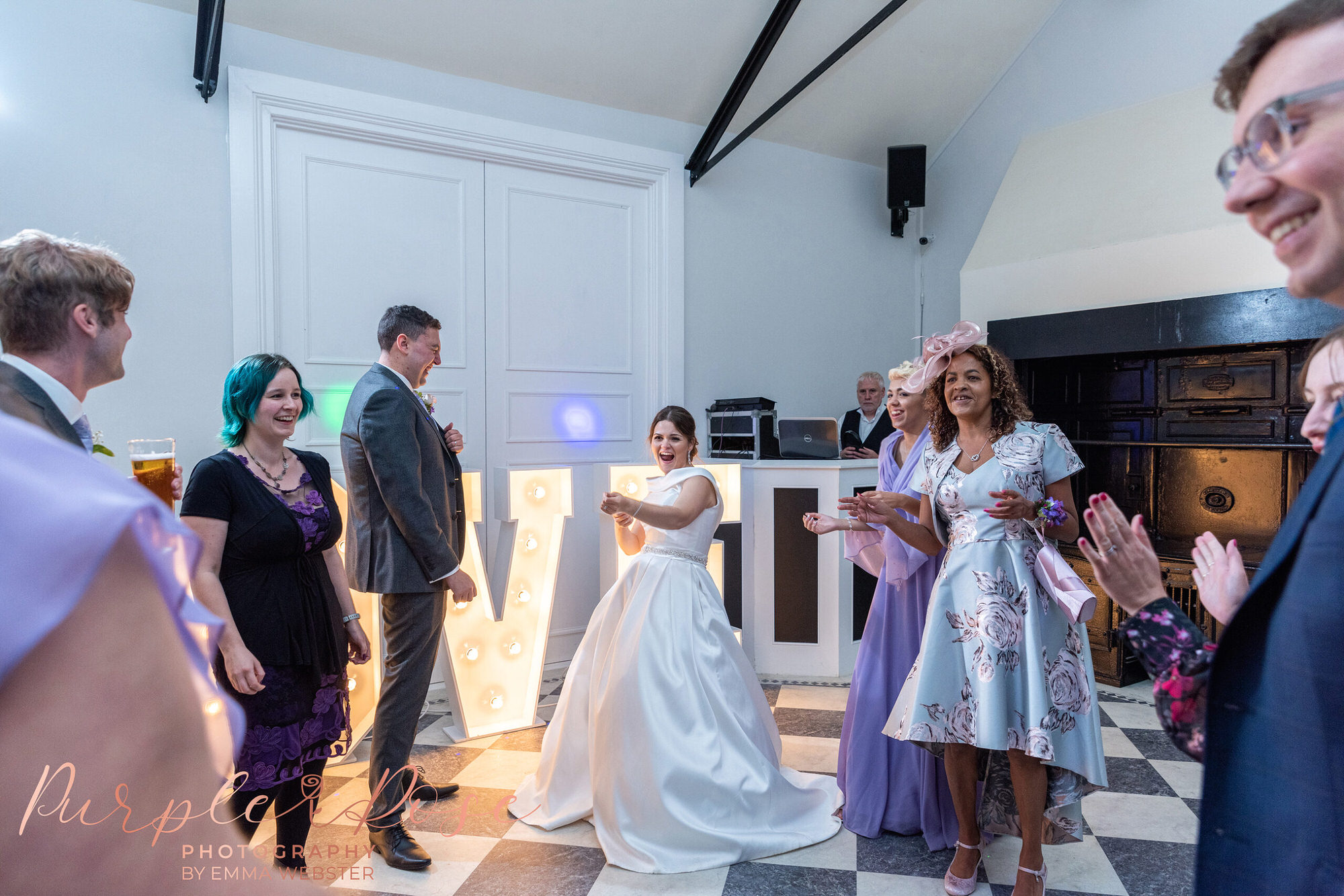 Bride dancing with her wedding guests