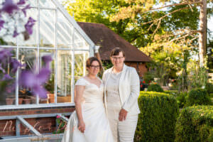 Brides by a green house