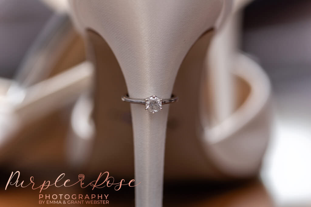 Engagement ring on a wedding shoe heel