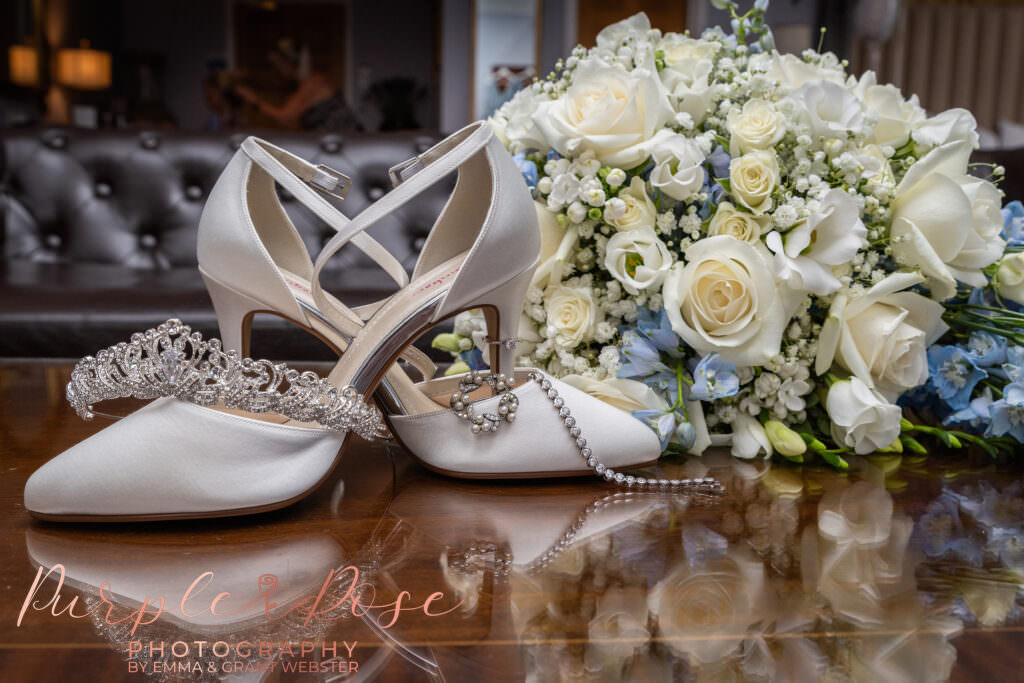 Brides shoes, jewllery and bouquet