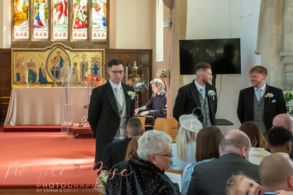 Groom waiting for his bride in the church