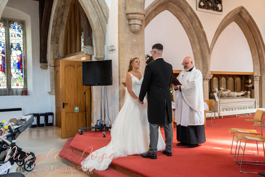 bride and groom stood together during their wedding ceremony