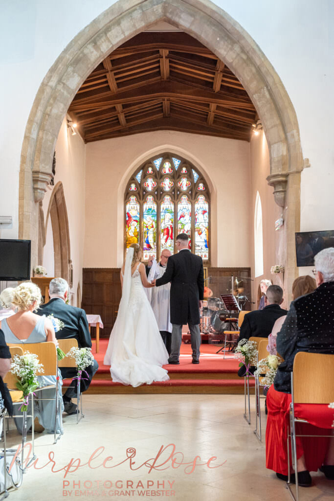 Bride and groom in a church during their wedding ceremony