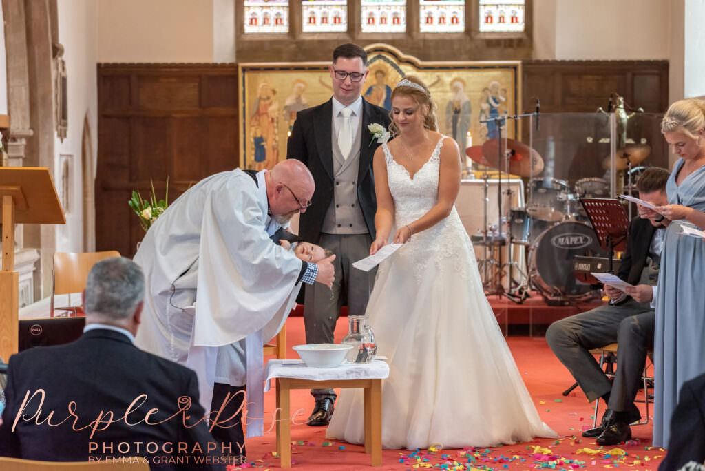 CHild being christend on her parent wedding day