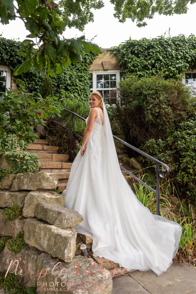 Bride s dress flwoing down stairway