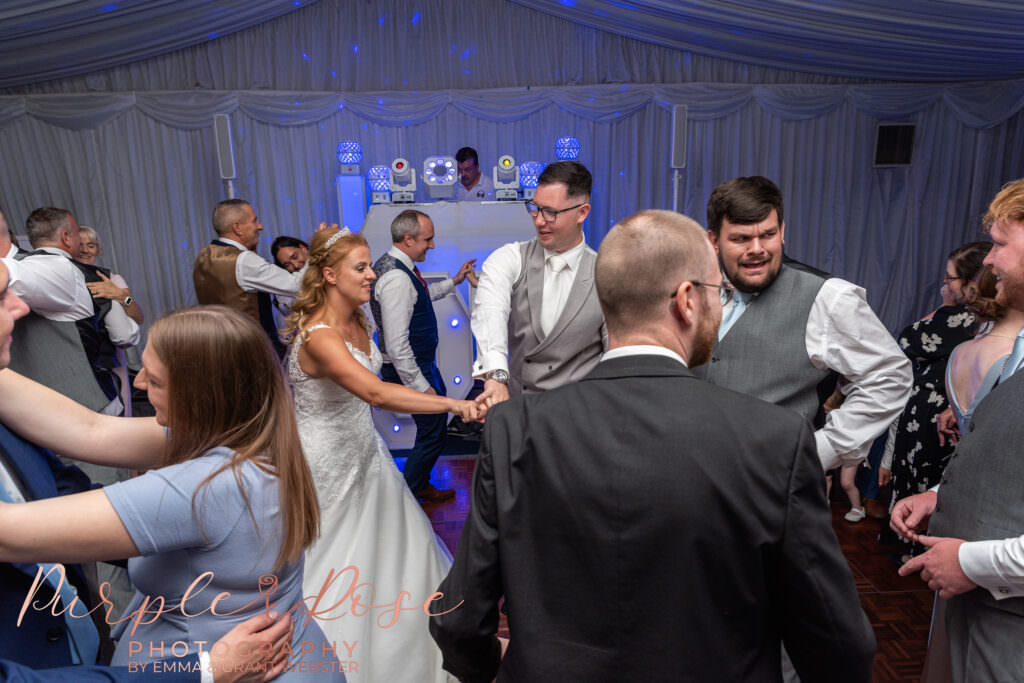 Bride and groom dancing at their wedding reception