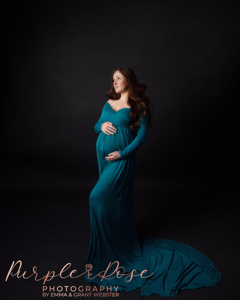 Mum to be in green dress at her maternity photoshoot in Milton Keynes
