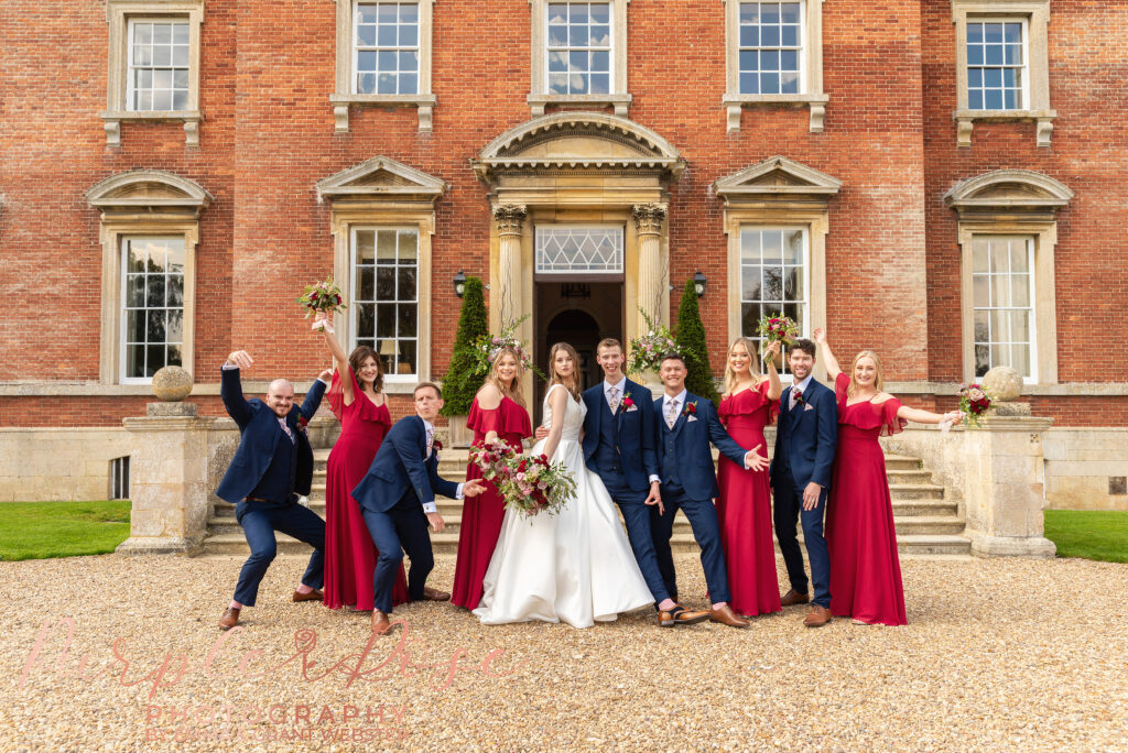 Group photo of bride, groom and their wedding guests on their wedding day in Milton Keynes