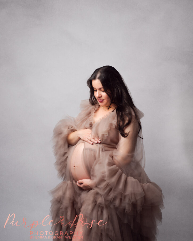 Photo of pregnant mum to be in a tulle gown at her maternity photoshoot on Milton Keynes