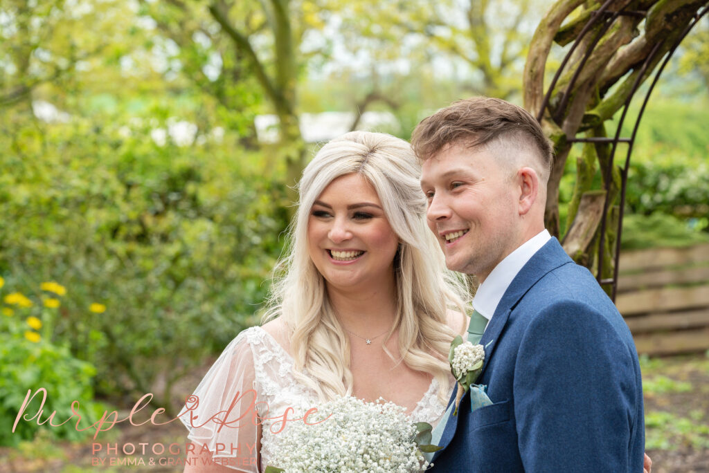Photo of bride and groom smiling on their wedidng day in Northampton