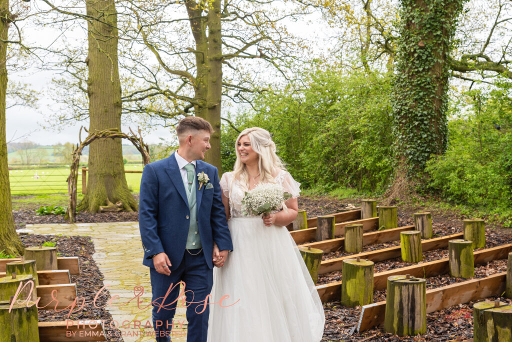 Photo of bride and groom wlaking together on their wedding day in Northampton