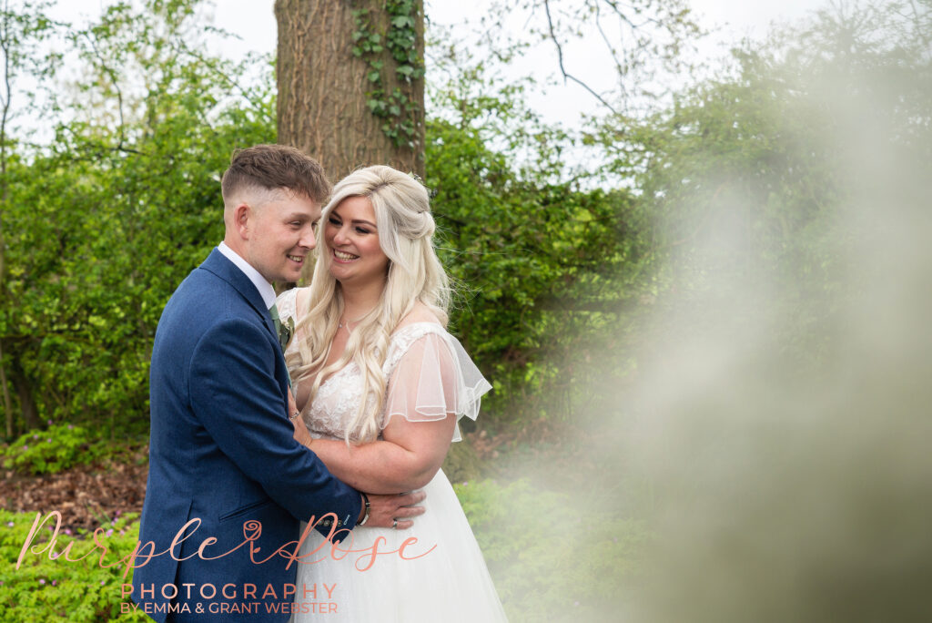 Photo of bride looking at her groom on their wedding day in Northampton