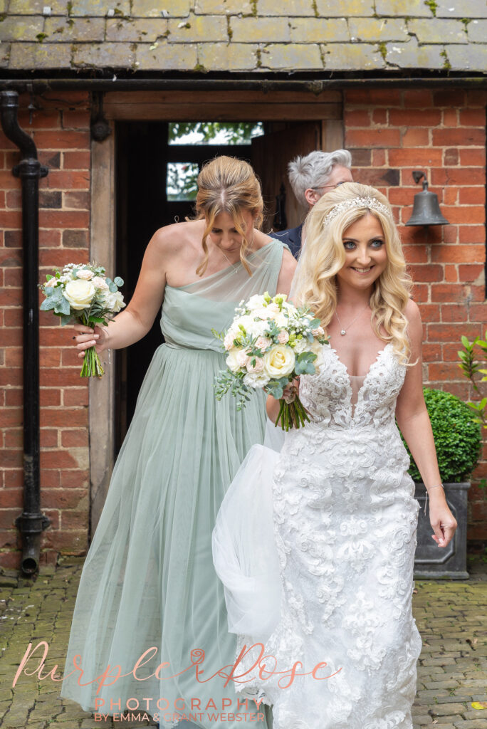 Photo of bride walking to her wedding ceremnoy in Northampton