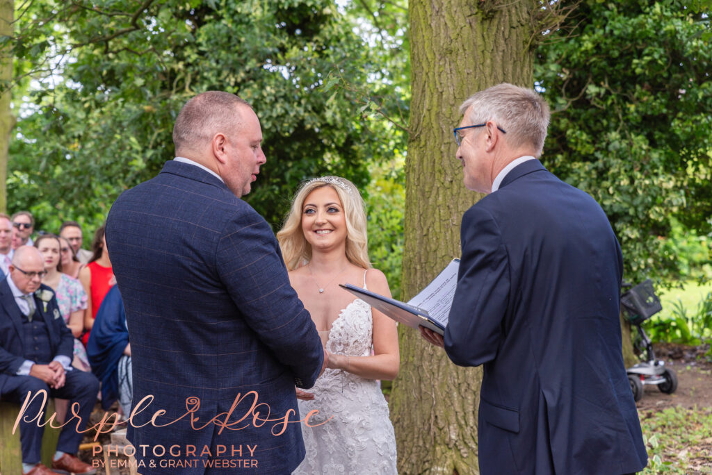 Photo of bride and groom during their wedding ceremony on their wedding day in Northampton