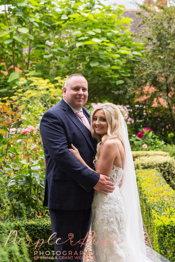 Photo of bride and groomarm in arm on their wedding day in Northampton