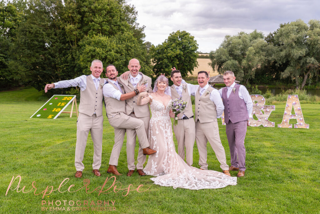 Photo of a bride and groom with their freinds on their wedding day in Milton Keynes