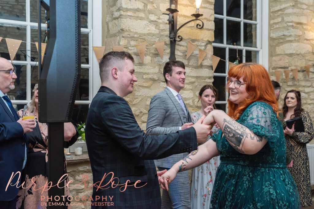 Photo of wedding guests dancing at a wedding in Milton Keynes