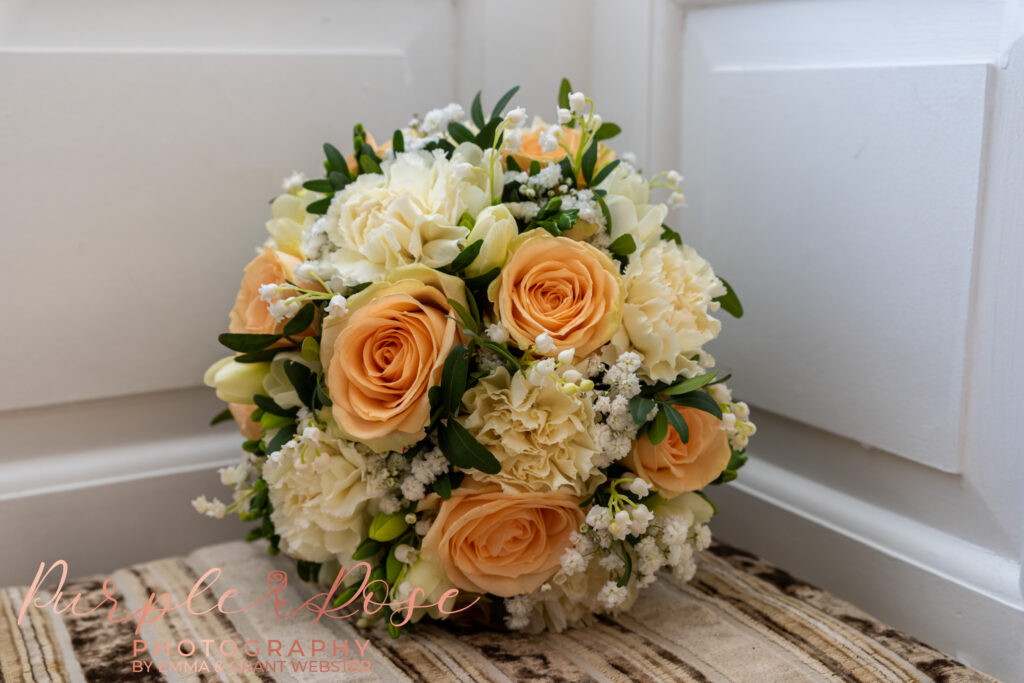 Photo of peacha nd white wedding bouquet at a wedding in Milton Keynes
